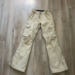 Tan women’s Oakley ski and snowboard pants